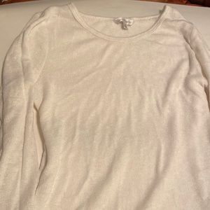 Sweater size medium ladies 3/4 length sleeves with sheer hem. Cream colored.